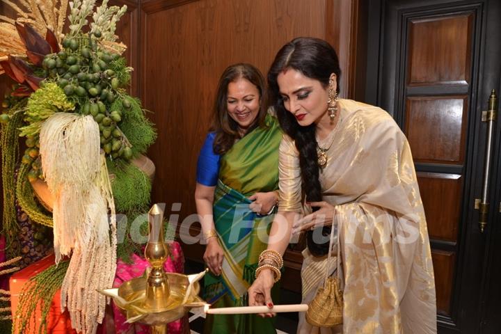 Rekha lighting the lamp at the Sahachari Foundations Show for Tarun Tahiliani