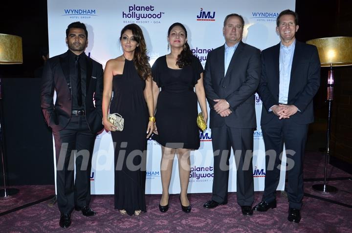 Celebs pose for the media at the Launch of Planet Hollywood