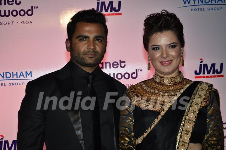 Sachin Joshi poses with wife Urvashi Sharma at the Launch of Planet Hollywood