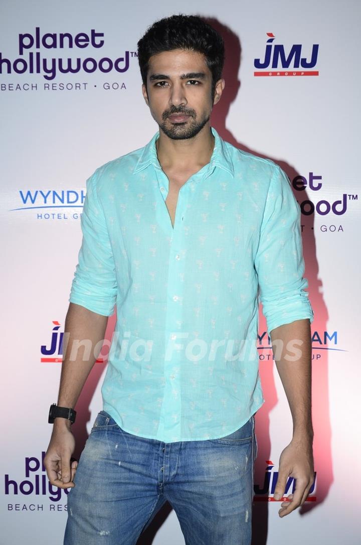 Saqib Saleem poses for the media at the Launch of Planet Hollywood