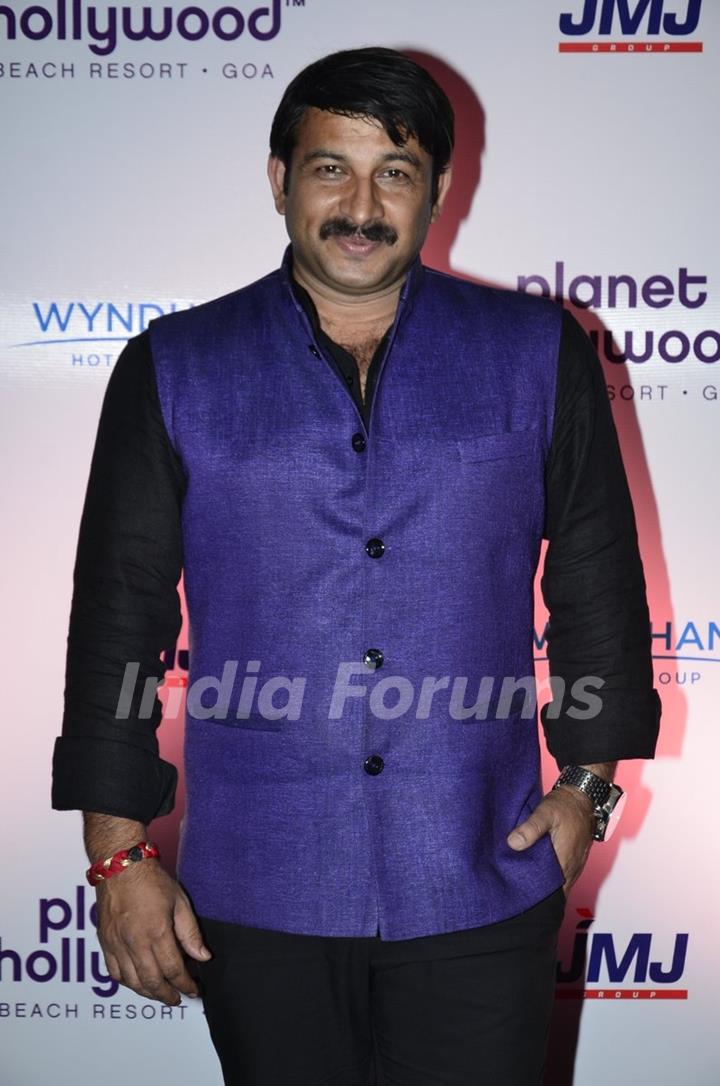 Manoj Tiwari poses for the media at the Launch of Planet Hollywood