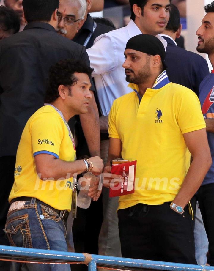 Sachin Tendulkar chats with Harbhajan Singh at the Opening Ceremony of the Indian Super League