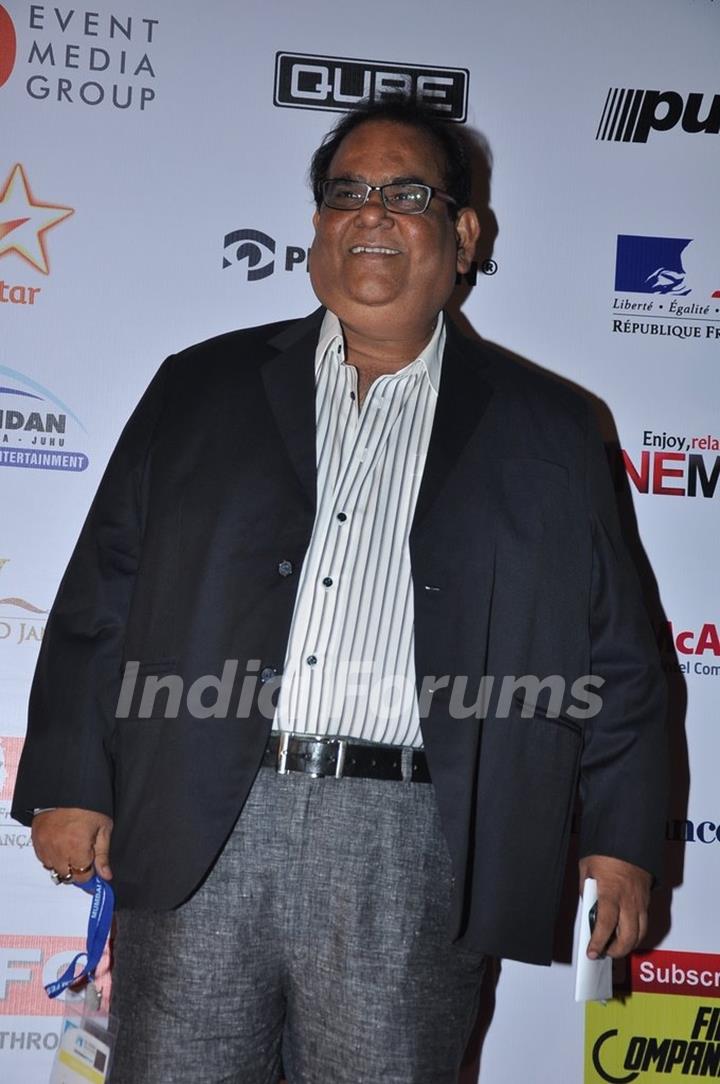 Satish Kaushik poses for the media at the 16th MAMI Film Festival