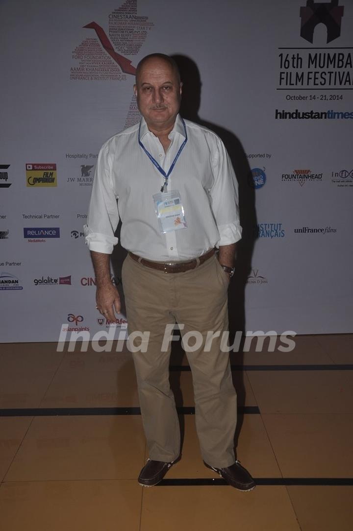 Anupam Kher poses for the media at the 16th MAMI Film Festival Day 3