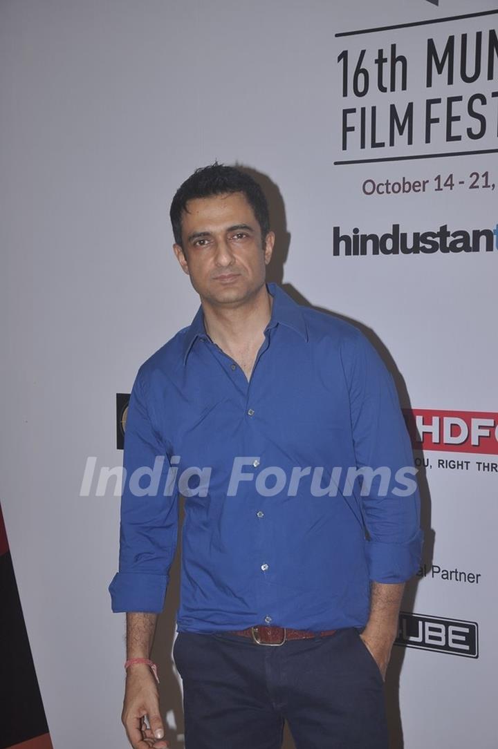 Sanjay Suri poses for the media at the 16th MAMI Film Festival Day 5