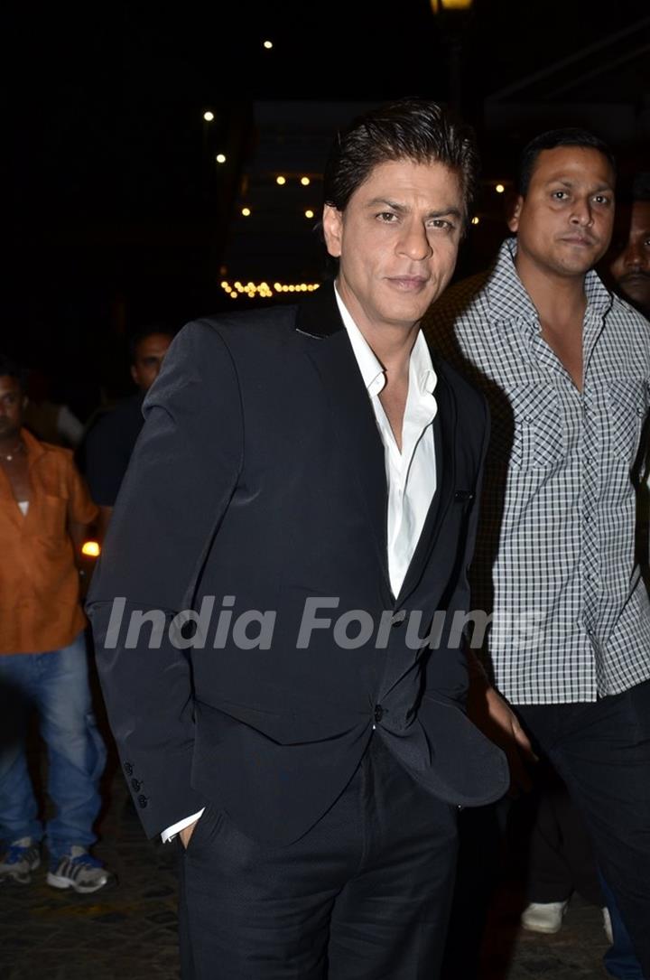 Shah Rukh Khan poses for the media at SBS Party