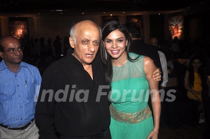 Mukesh Bhatt poses with a guest at the Launch of Rajneeti 2