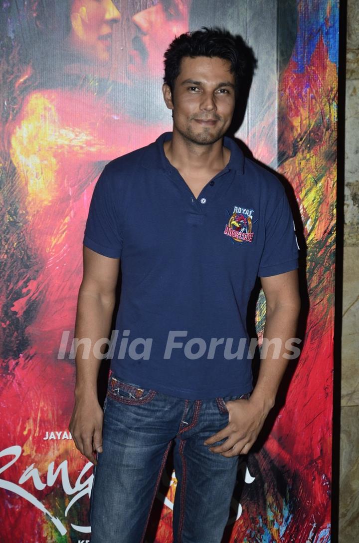 Randeep Hooda poses for the media at the Special Screening of Rang Rasiya