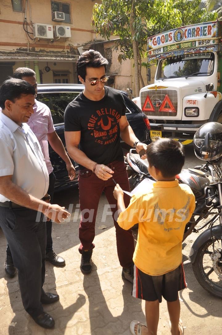 Sonu Sood signs an aoutograph at the Launch of the New Edition of Stardust Rising