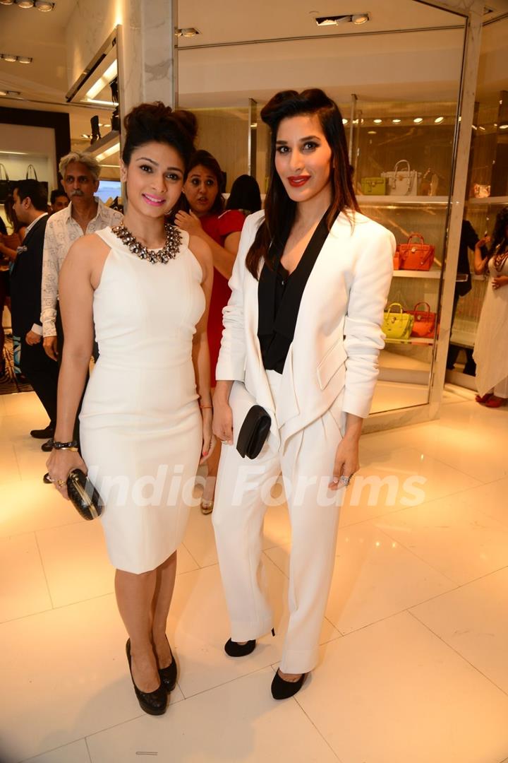 Sophie Choudry and Tanishaa Mukerji pose for the media at Michael Korrs Store Launch