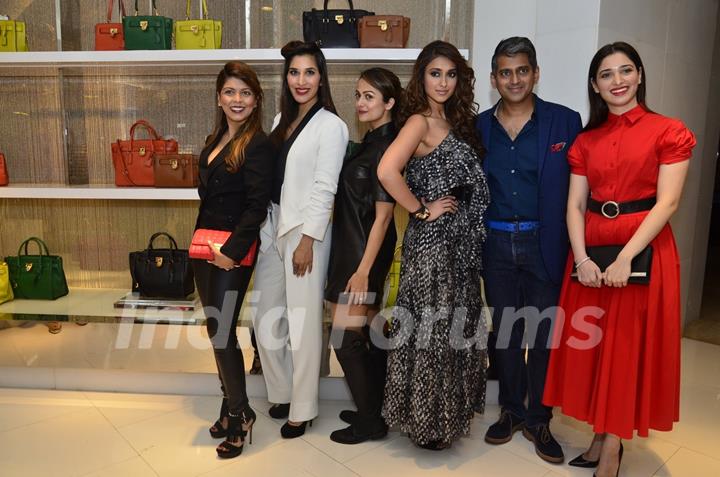 Celebs pose for the media at Michael Korrs Store Launch