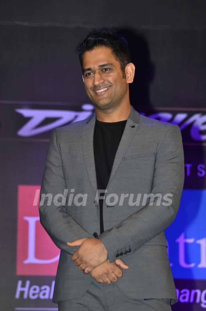 MS Dhoni poses for the media at Positive Health Awards
