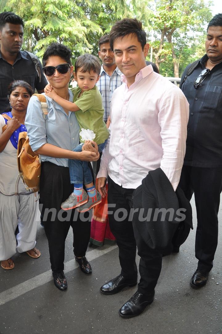 Aamir Khan and Kiran Rao along their son Azad at airport while leaving for Arpita Khan's Wedding
