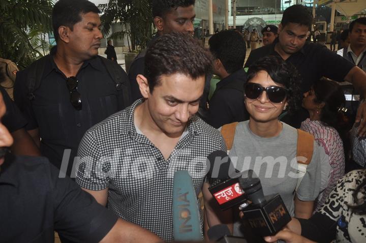 Aamir Khan was snapped giving media byte at airport while returning from Arpita Khan's Wedding