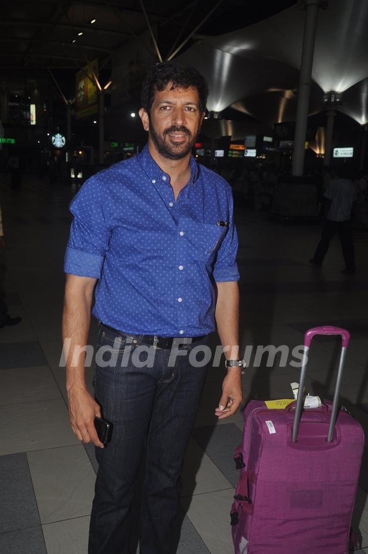 Kabir Khan poses for the media at airport while returning from Arpita Khan's Wedding