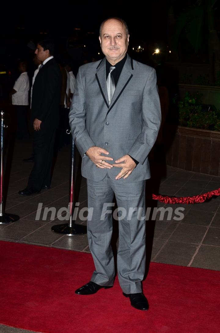 Anupam Kher poses for the media at Arpita Khan's Wedding Reception