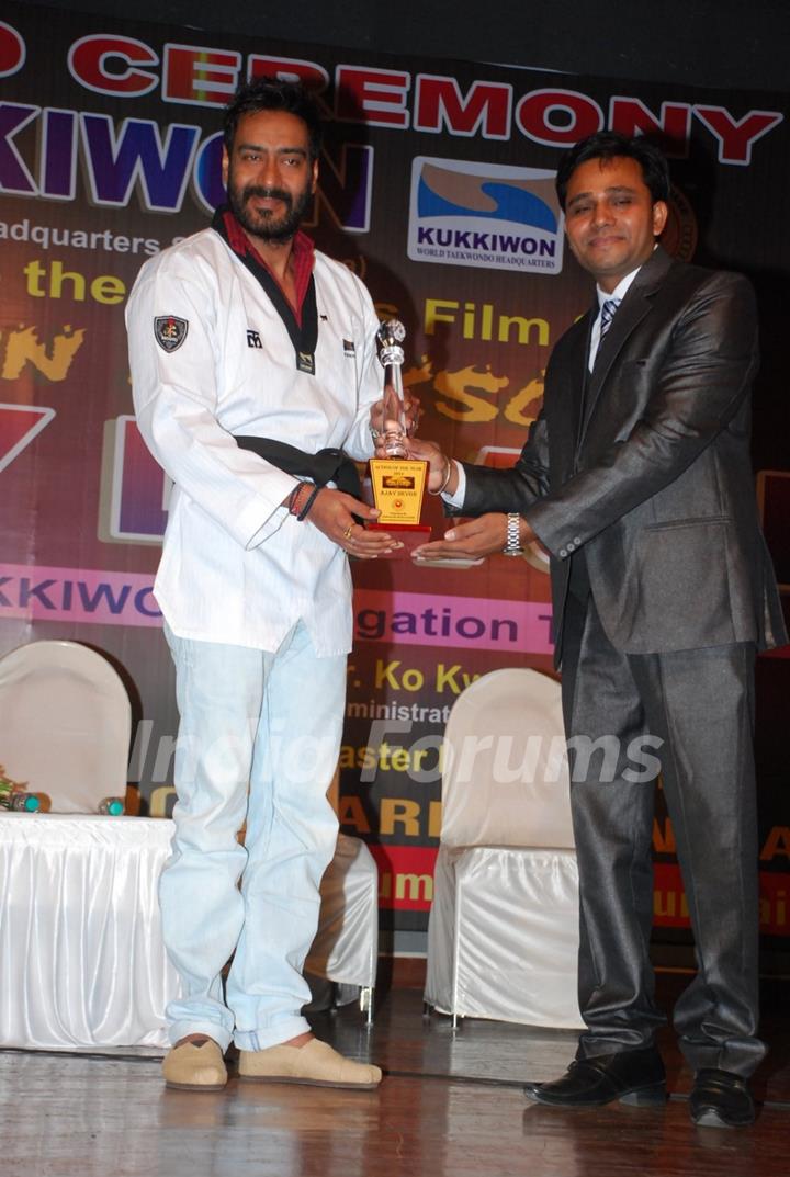 Ajay Devgn felicitated with a Trophy by Taekwondo Masters from Korea