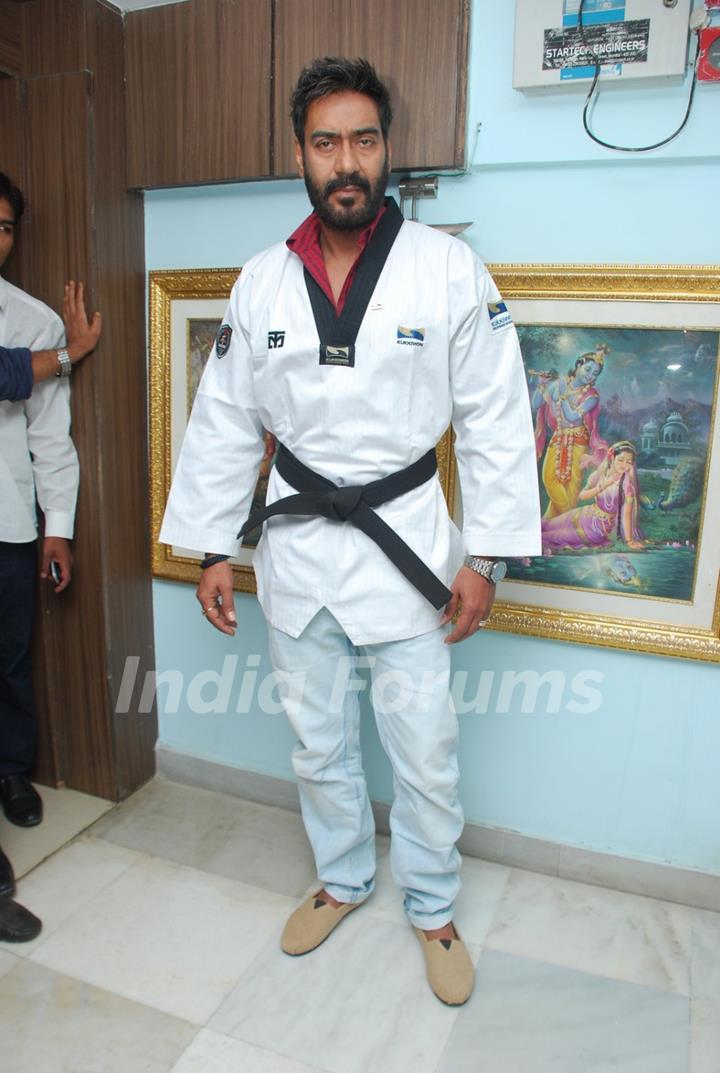 Ajay Devgn poses for the media at Taekwondo Felicitation Event