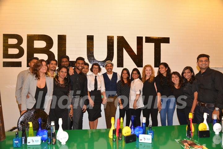 Farhan Akhtar and Adhuna Akhtar pose with the staff at the Launch of BBlunt Salon