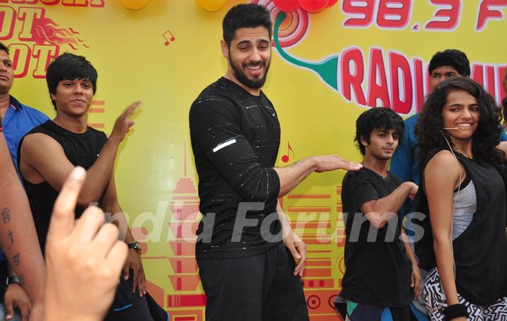 Sidharth Malhotra performs with his fans at the Radio Mirchi event at Equal Street