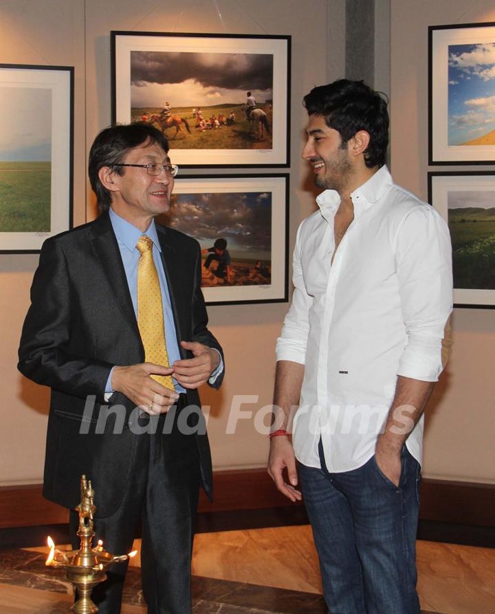 Mohit Marwah in conversation with a guest at Mongolia Day, An Art Exhibition by Shantanu Das