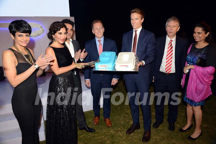 Sophie Choudry cuts the cake at the British Airways Bash