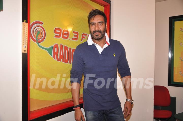 Ajay Devgn poses for the media at the Promotions of Action Jackson at Radio Mirchi