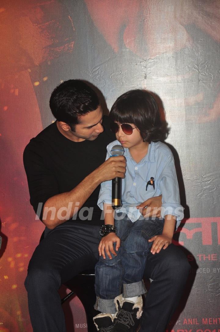 Varun Dhawan interacts with a young fan at the Trailer Launch of Badlapur