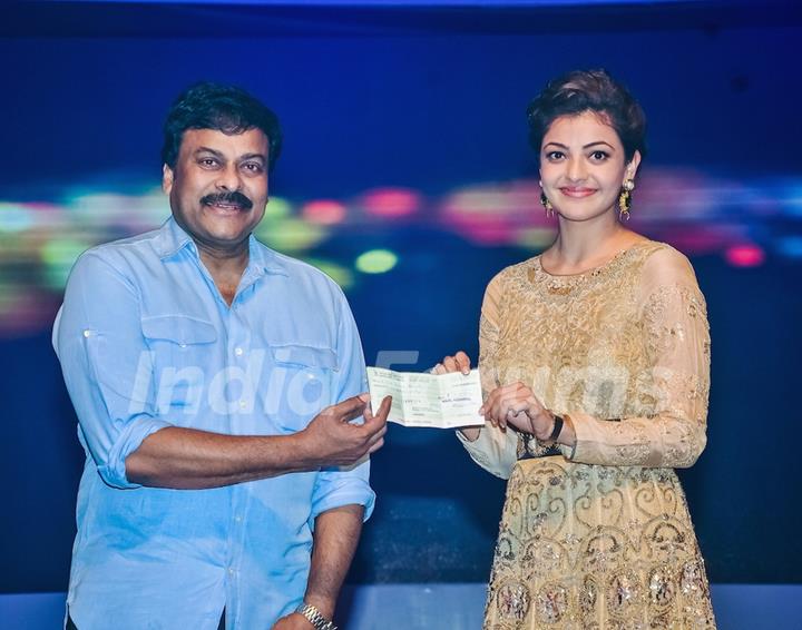 Chiranjeevi and Kajal Aggarwal makes a donation at HudHud Relief Fundraising Campaign