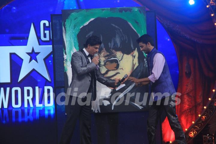 Shah Rukh Khan with a contestant at the Opening of Got Talent - World Stage Live