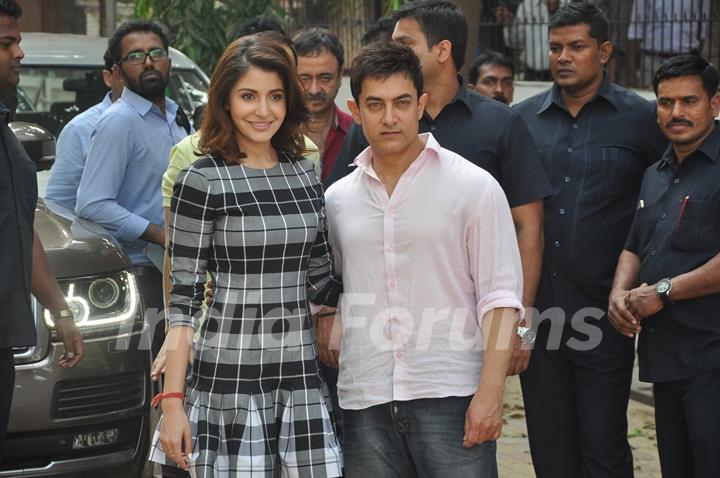 Aamir Khan and Anushka Sharma poses for the media at P.K. Game Launch