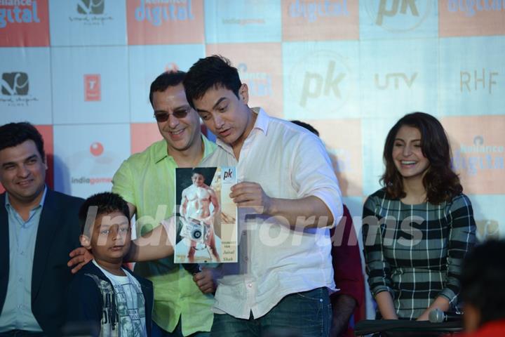 Aamir Khan interacts with a young fan at P.K. Game Launch