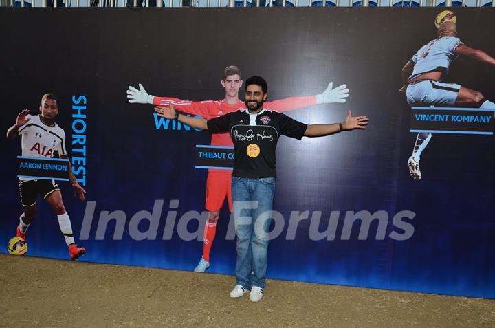 Abhishek Bachchan poses for the media at Barclays Premier League