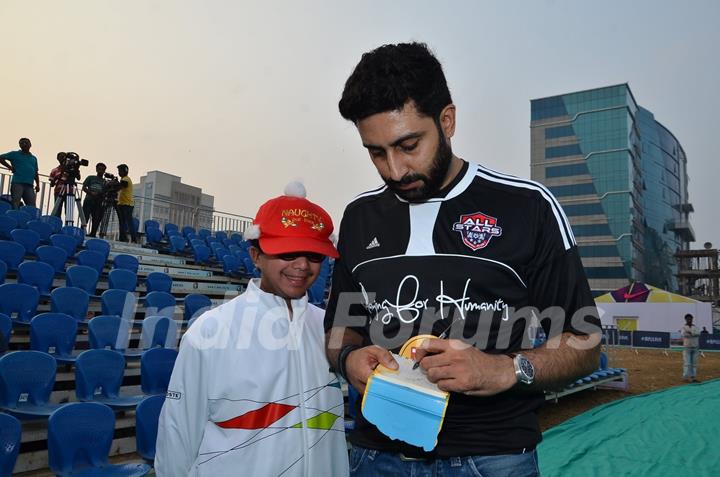Abhishek Bachchan signs autograph for a young fan at Barclays Premier League
