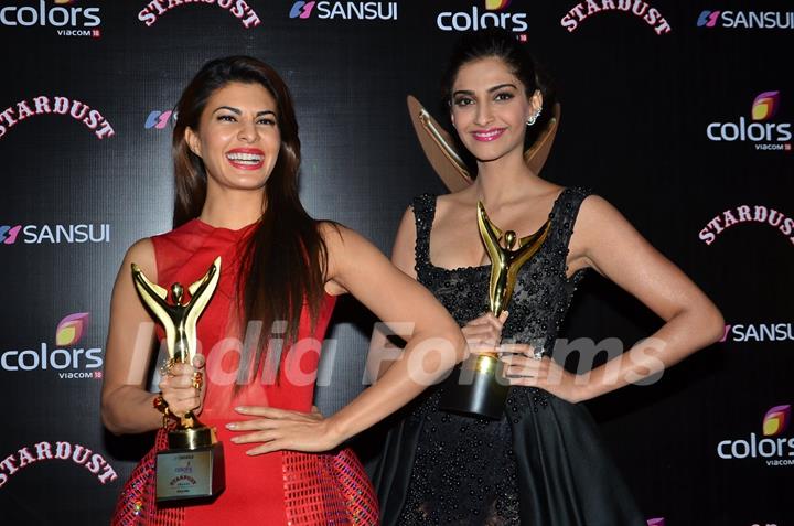 Jacqueline Fernandes and Sonam Kapoor pose with their Awards at Sansui Stardust Awards Red Carpet