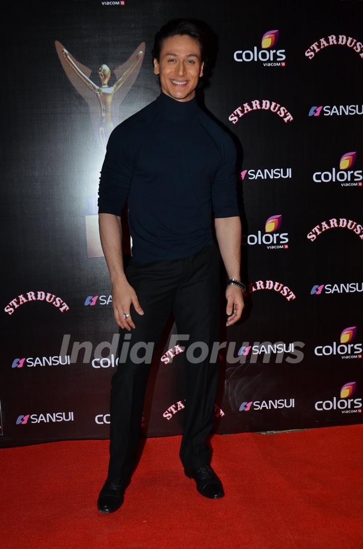 Tiger Shroff poses for the media at Sansui Stardust Awards Red Carpet