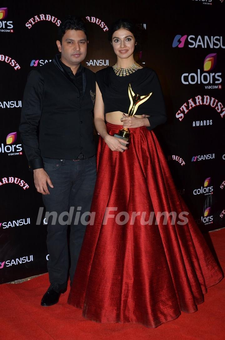 Bhushan Kumar poses with wife Divya Kumar at the Sansui Stardust Awards Red Carpet