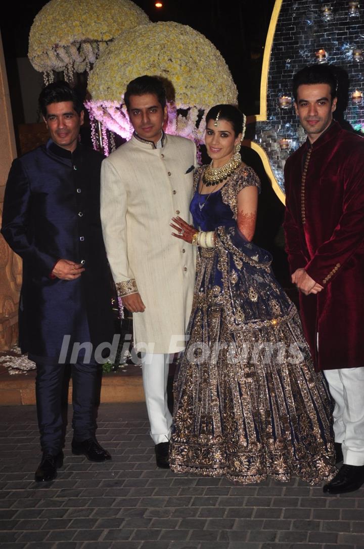 Manish and Punit Malhotra pose with the newly wedded couple Riddhi Malhotra and Tejas Talwalkar
