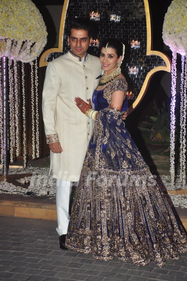Riddhi Malhotra and Tejas Talwalkar pose for the media at their Wedding Reception