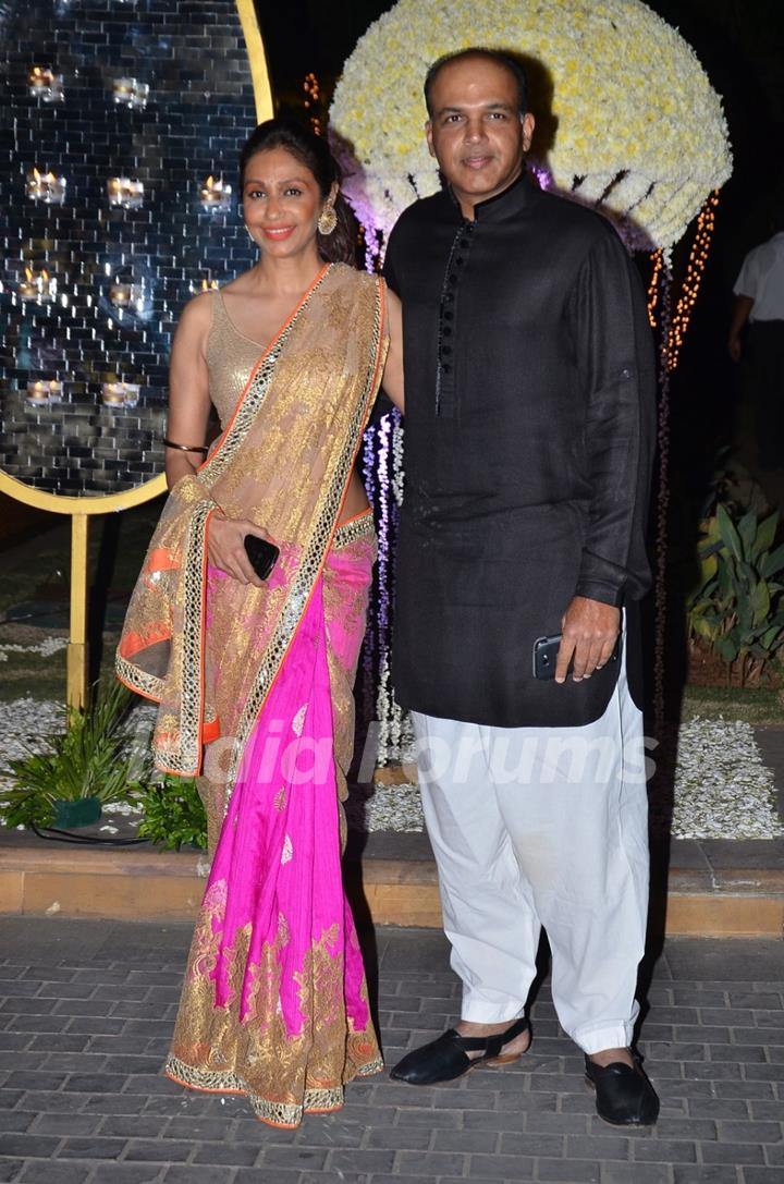 Ashutosh Gowarikar poses with wife at the Wedding Reception of Riddhi Malhotra and Tejas Talwalkar