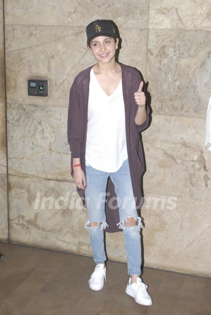 Anushka Sharma poses for the media at the Special Screening of P.K.