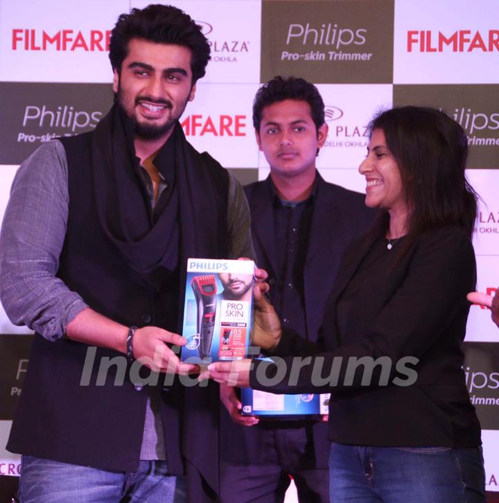 Arjun Kapoor receives a gift at the Launch of the Latest Issue of Filmfare Magazine