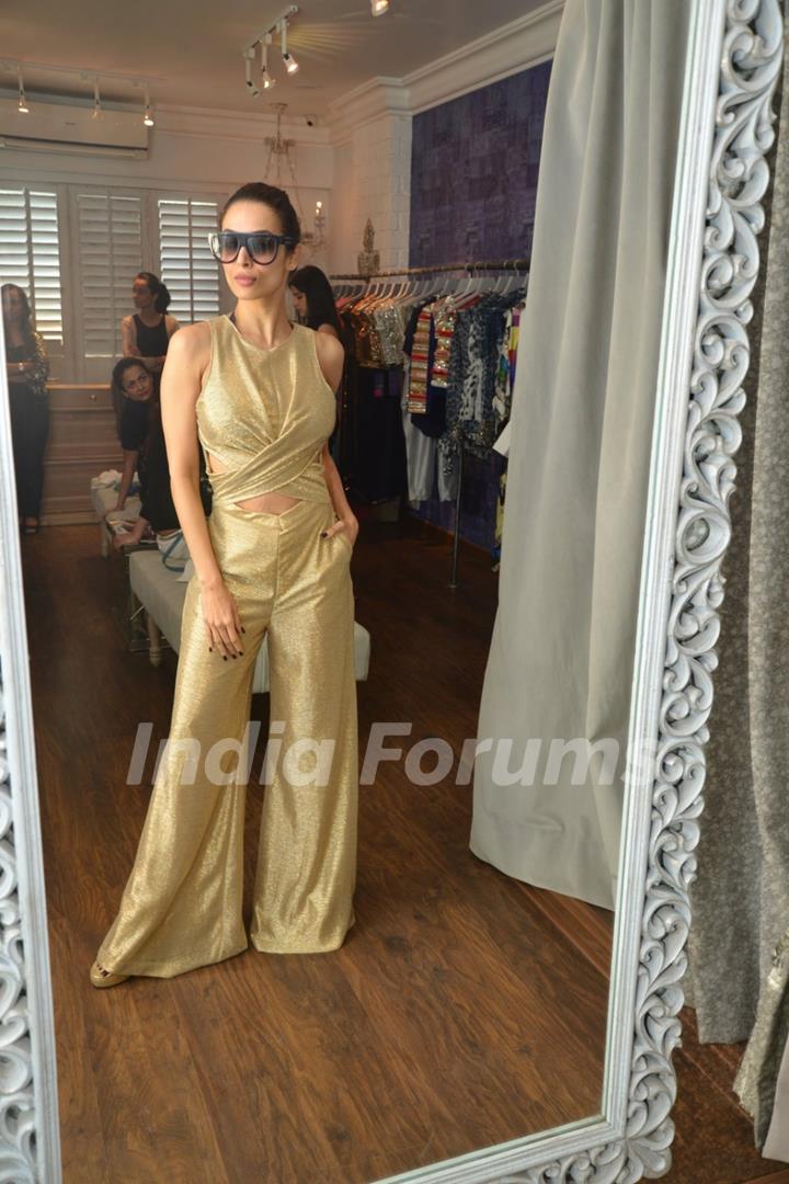 Malaika Arora Khan poses for the media at Seema Khan's Christmas Collection Launch