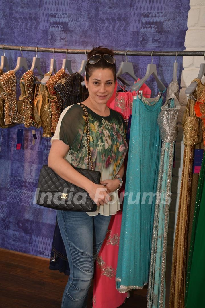 Neelam Kothari poses for the media at Seema Khan's Christmas Collection Launch