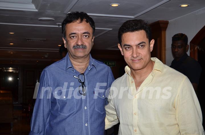 Aamir Khan and Rajkumar Hirani pose for the media at P.K. Contest Winners Meet