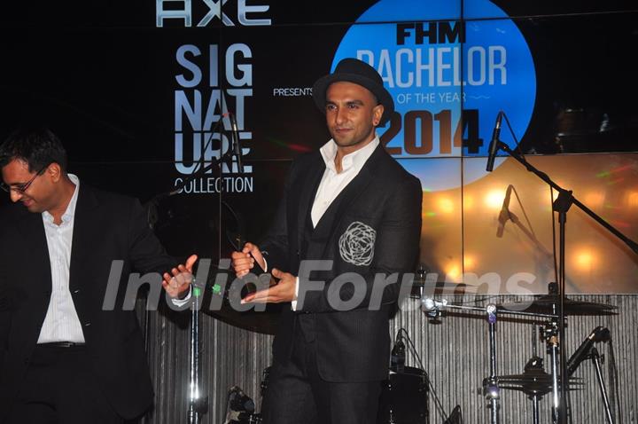 Ranveer Singh poses with his award at FHM Bachelor of the Year Bash