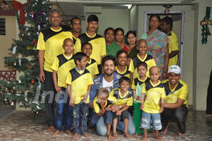 Ali Fazal poses with Ngo Kids at the Christmas Celebrations