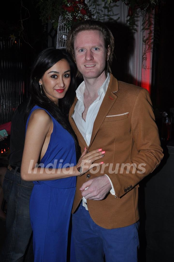 Alex O Neil poses with a friend at Nido's New Year Bash