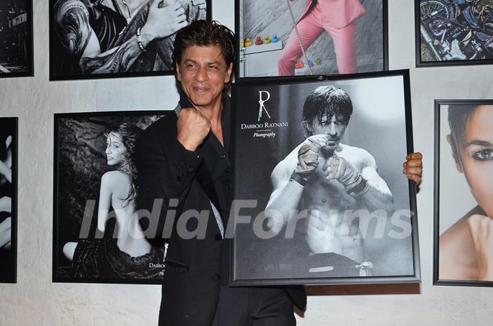 Shah Rukh Khan poses with his photo at Dabboo Ratnani's Calendar Launch