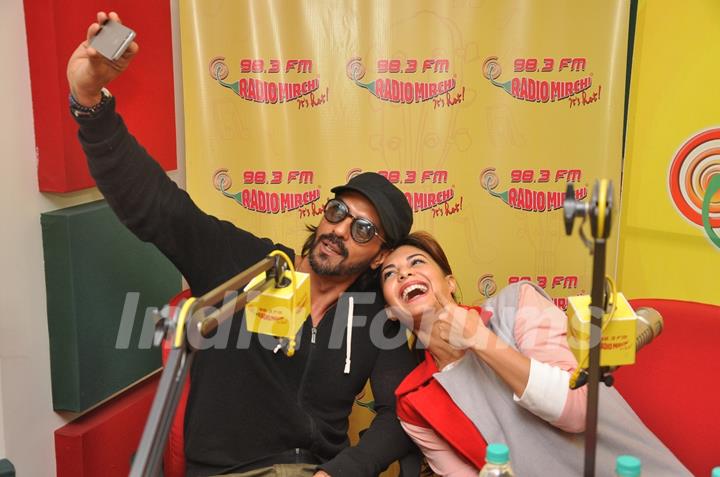 Arjun Rampal clicks a selfie with Jacqueline Fernandes at the Promotions of Roy on 98.3 Radio Mirchi